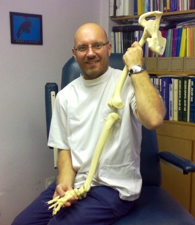 Jonathan Small Family Podiatrist with a model leg skeleton