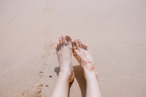 Toes and feet on the beach