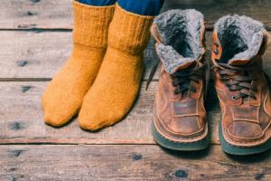 Feet wearing socks, and shoes.