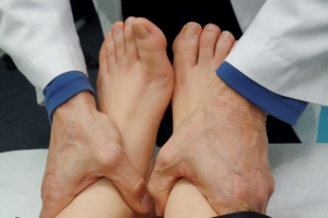 Podiatrist Looking At Feet